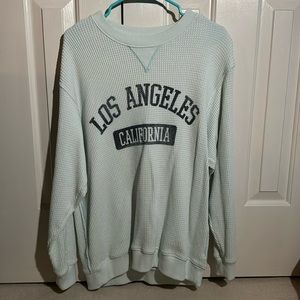 Light teal Aerie oversized “Los Angeles California” crewneck.